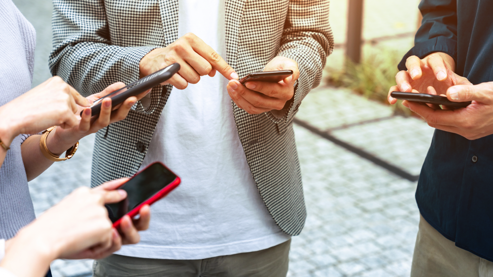 A group of people using smartphones