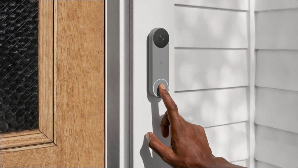 A Nest video doorbell mounted on the frame of a home's front door.