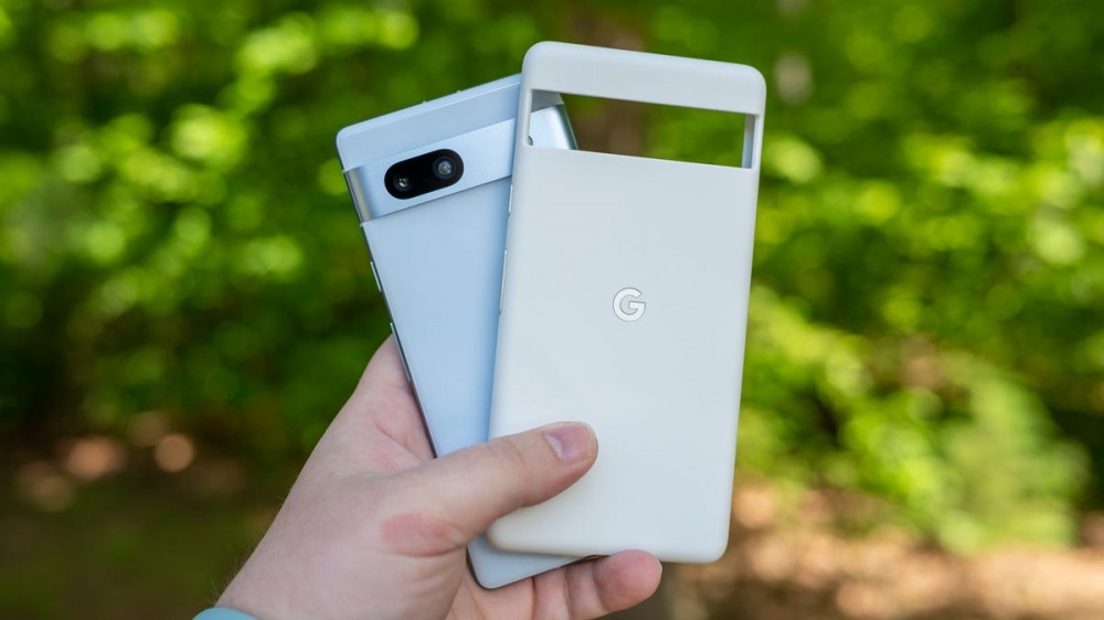 Person holding a case next to the Google Pixel 7a