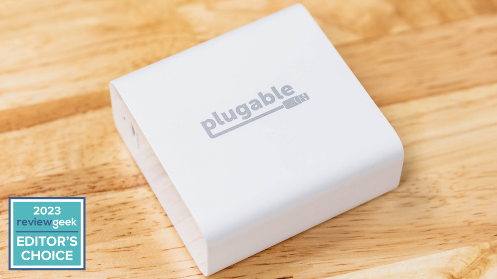 The Plugable 140W GaN Charger on a desk.